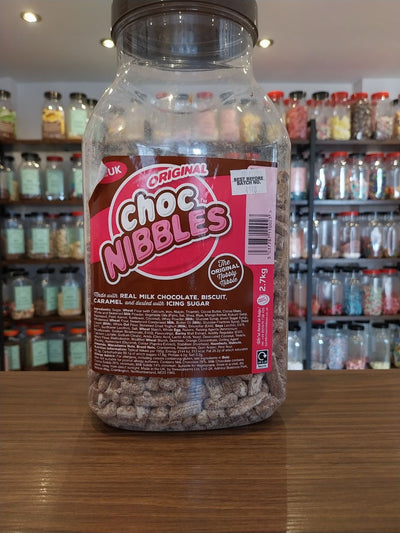 Choc Nibbles - Nobbly nibbles with real milk chocolate, caramel and dusted with icing sugar