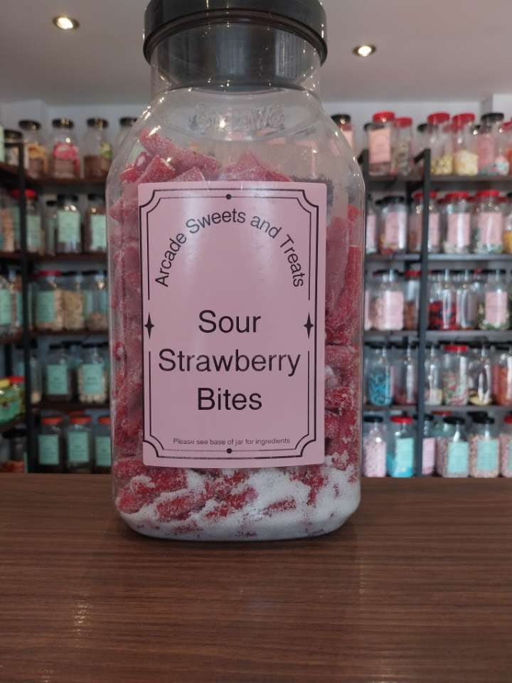 Sour Strawberry Bites - Fizzy sugar coated sour strawberry flavour sweets with a fondant filling